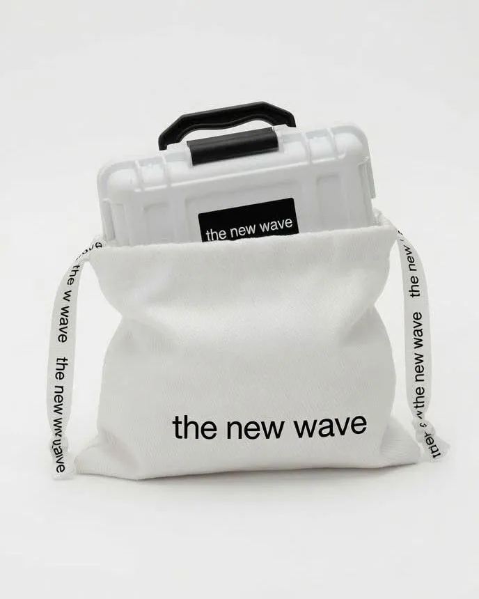 The carry case sliding into its drawstring pouch